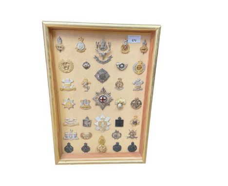 Collection of thirty three various British Military cap badges to include Chaplins badges and Queen's Own Hussars, mounted in