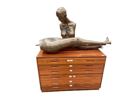 Paul de Delve (1945-2023) his teak plan chest, six drawers 98cm wide x 51cm deep x 70cm high, together with a shop mannequin
