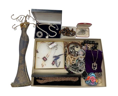 Group of costume jewellery including Swarovski crystal pendant necklace, simulated pearls, gilt metal chains etc and a manneq