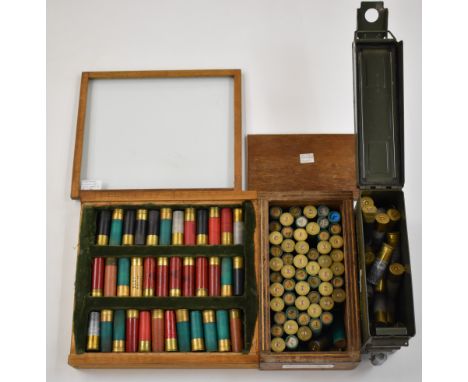 One-hundred-and-thirty-two 8 bore shotgun cartridges including collector's examples, some in oak display case and some in met