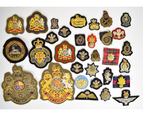 Collection of twenty nine bullion badges including South Wales Borderers, Grenadier Guards, Yorkshire Light Infantry, Queen's