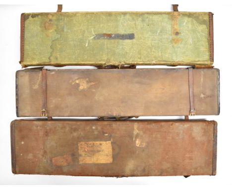 Three vintage leather and canvas bound shotgun carry cases, one with 'Army &amp; Navy Co-operative Society Ltd 105 Victoria S