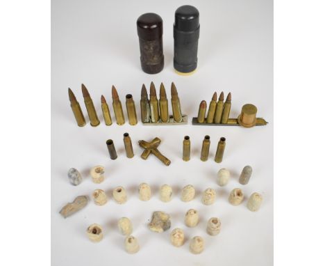 Small collection of inert ammunition including brass small arms examples, two rubber bullet / baton rounds and Mini&eacute; t