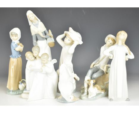 Collection of Lladro / Nao figures, the four largest Lladro includes lady with dog, tallest 28cm