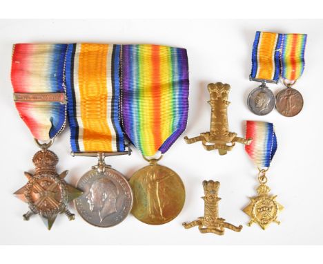 British Army WW1 11th Hussars medal trio comprising 1914 'Mons' Star with clasp for 5th August to 22nd November 1914, War Med