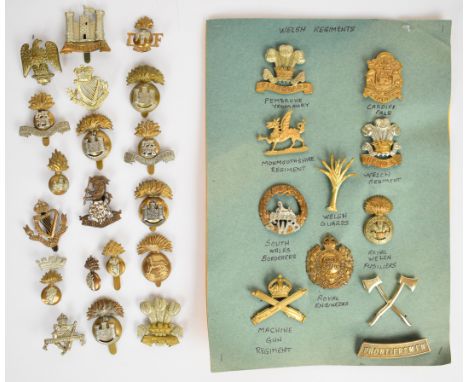 Eighteen British Army Irish Regiments cap badges including Royal Ulster Rifles, Inniskilling Fusiliers, Royal Dublin Fusilier