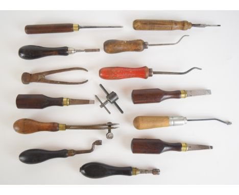 Fourteen vintage gun or gunsmith tools including screwdrivers, bullet moulds, chequering tools, nipple keys etc.&nbsp;