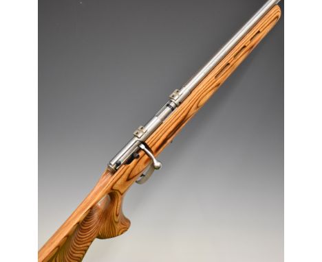 Savage Model 93R17 .17 HMR bolt-action rifle with thumb-hole grip to the laminated show wood stock, magazine, sling and scope
