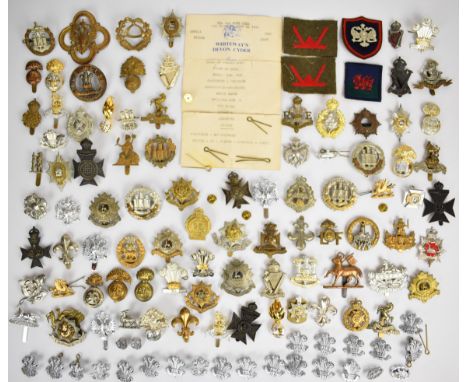 Large collection of approximately 100 British Army cap badges including Royal West Kent Regiment, The Essex Regiment, Norfolk