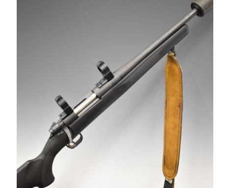 Mossberg 100 ATR .243 bolt-action rifle with textured semi-pistol grip and forend and raised cheek piece to the composite sto