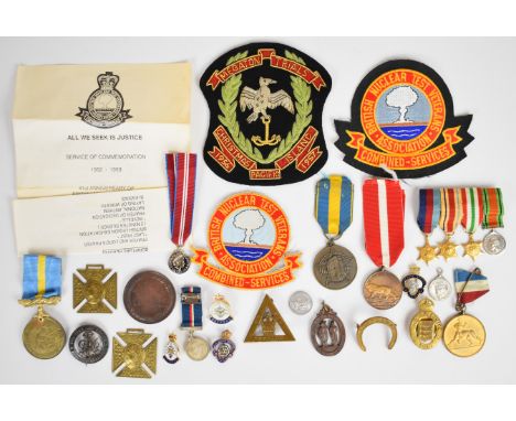 Collection of military badges including HM Armed Forces Veteran, British Nuclear Test Veterans Association, Royal British Leg