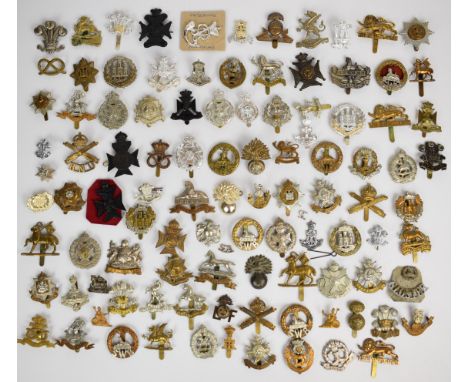 Large collection of approximately 100 British Army cap badges including Lancashire Fusiliers, Middlesex Regiment, South Wales