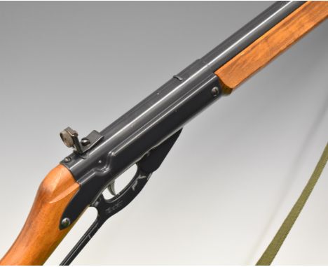 Daisy Model 99 Winchester style underlever-action air rifle with wooden grip and forend, canvas sling and adjustable peep-hol