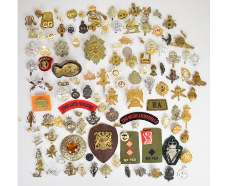 Collection of approximately 100 British Army badges including Scots Greys, 92nd Highlanders, Queen's Own Dorset Yeomanry, Que