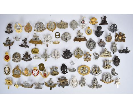 Collection of approximately 60 British Army badges including Royal Sussex Regiment, Gloucestershire Regiment, Norfolk Regimen
