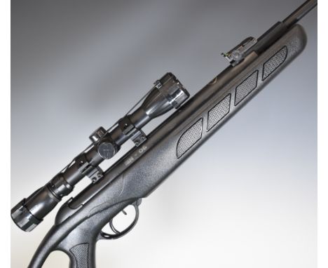 Kral IN-06 S .22 air rifle with composite stock, textured semi-pistol grip, adjustable cheek piece and signs and Konus 3-9x32