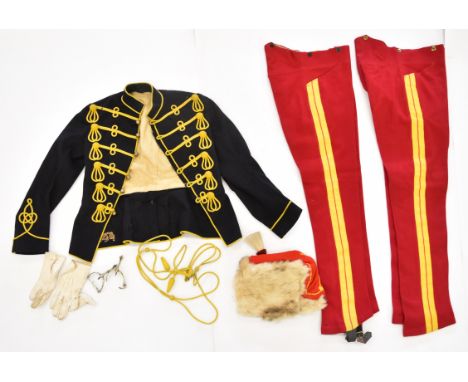 British Army 11th Hussars (Prince Albert's Own) uniform comprising two pairs of breeches, both with remnants of paper label, 