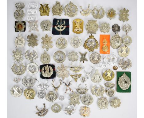 Collection of approximately 60 British Army Scottish Regiment badges including Royal Scots Guards, Royal Scots Fusiliers, Bla