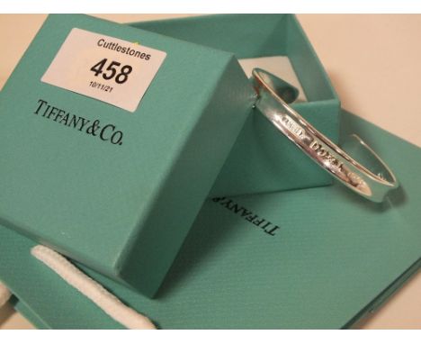 A TIFFANY STYLE BANGLE WITH BOX AND BAG