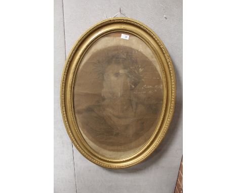 AN ANTIQUE PENCIL PORTRAIT STUDY OF A LADY HOLDING AND POINTING TO A SCROLL IN GILT OVAL FRAME SIZE - 63CM X 49CM 