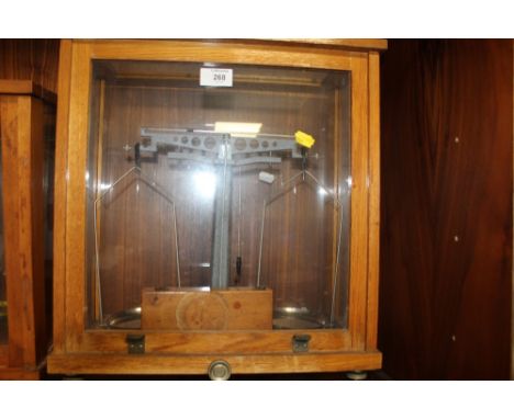 A CASED SET OF VINTAGE SCALES AND WEIGHTS