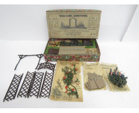 A boxed Britains lead Miniature Gardening set 9MG, comprising various plants and flowers, crazy paving, flower beds, walls, t