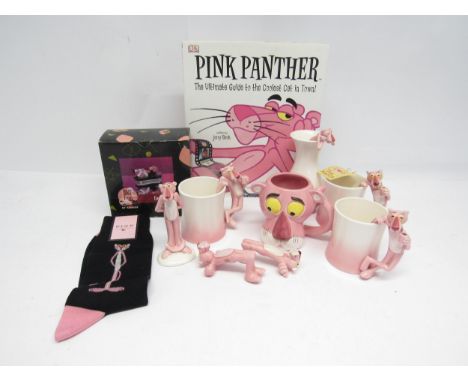 A group of Pink Panther related collectables including ceramic figures, mugs and vase, boxed cruet set, socks, and 'Pink Pant