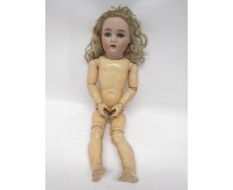 An early 20th Century Simon &amp; Halbig Kammer &amp; Reinhardt bisque head girl doll with blonde wig, striated blue glass sl