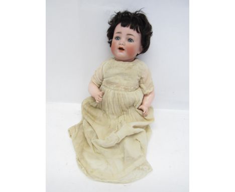 An early 20th Century German Kammer &amp; Reinhardt for Simon &amp; Halbig 126 bisque head doll with blue glass sleeping eyes