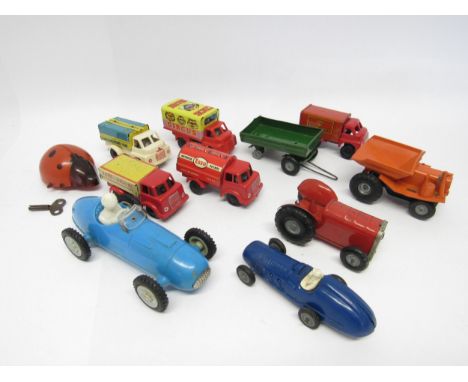 A group of loose tinplate and plastic model vehicles including Triang Minic clockwork tractor and trailer, ladybird, and dump