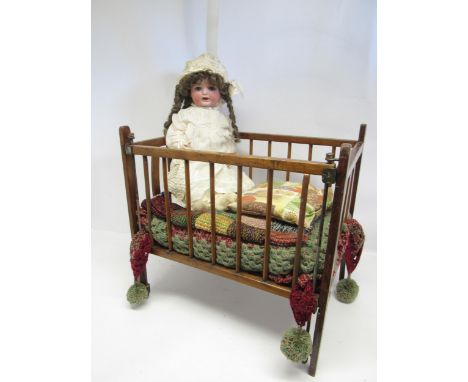 An early 20th Century German Heubach Koppelsdorf bisque head doll with striated blue glass sleeping eyes, painted features, o