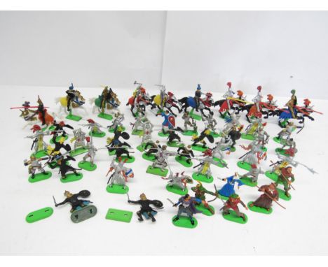 A collection of Britains and Britains Deetail plastic figures on metal stands, including Medieval Knights, Saracens and Robin