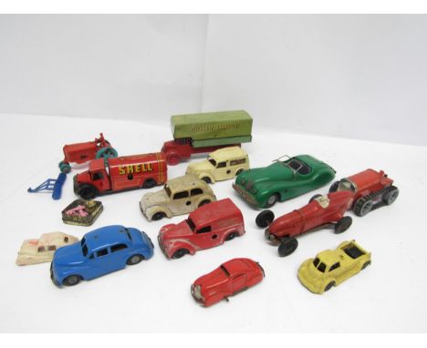 A collection of loose and playworn tinplate and plastic model vehicles including Triang Minic clockwork Jaguar XK120, 11M tra