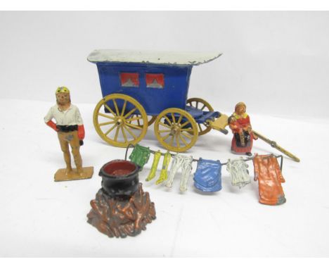 A playworn Charbens lead Gypsy Caravan set, comprising caravan (shafts damaged), mother &amp; child and husband figures, wash