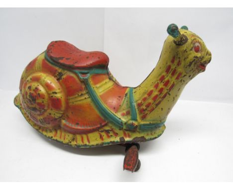 A 1950s Mobo pressed steel pedal ride-on snail, 43cm tall