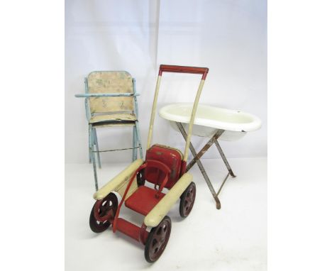 A 1950s mobo Magic dolls pushchair, an enamelled bath on wrought iron stand and a dolls high chair (3)