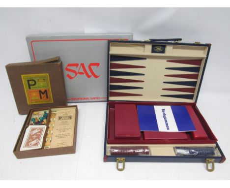 A boxed Studio Anne Carlton backgammon set and a vintage 'Plus &amp; Minus' card game (2)