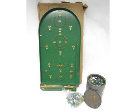 A boxed Chad Valley bagatelle board and a quantity of 20th Century marbles
