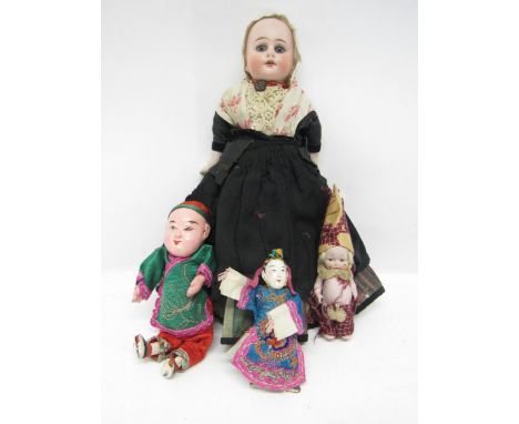 An early 20th Century Heubach bisque shoulder head doll with fixed blue glass eyes, painted features and open mouth showing f