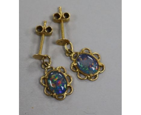 A pair of gold and opal pendant earrings