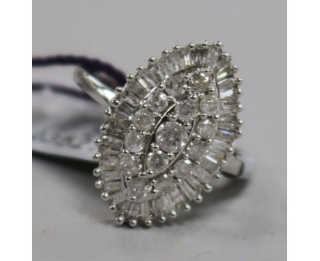 A diamond and 9ct white gold marquise cluster ring