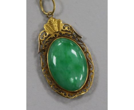 A Chinese gold framed jade pendant, in a Tessier box