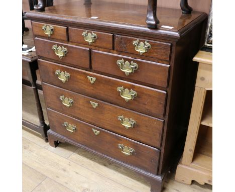An 18th century style oak chest, of five short and three long drawers, W.90cm
