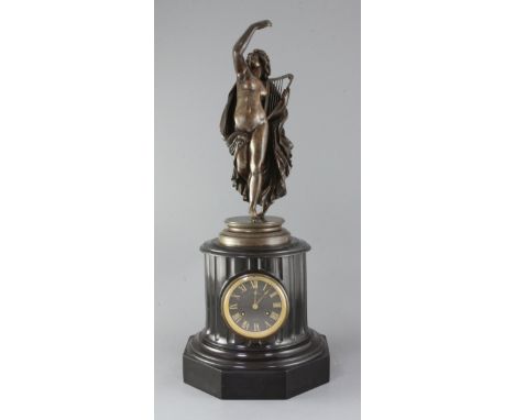 Jean-Jacques Pradier (1790-1852). A bronze figure of "La Poesie Legere", signed in the bronze, on a black marble clock socle 