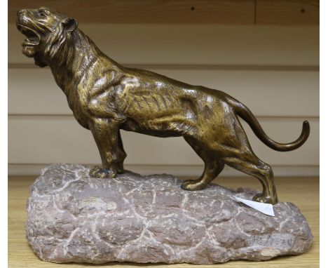 A bronze tiger on stone base, signed Heiteau