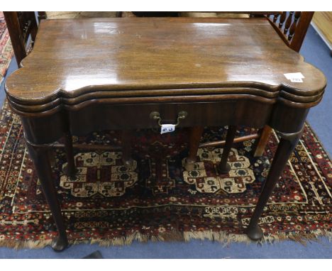 An early 18th century style mahogany triple flap card table, W.83cm