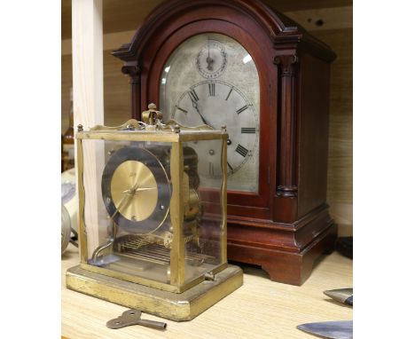 A German mahogany mantel clock and a brass chiming clock
