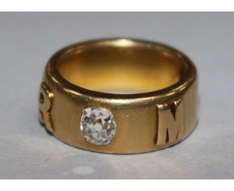 An 18ct gold and diamond memorial ring, 12 grams gross