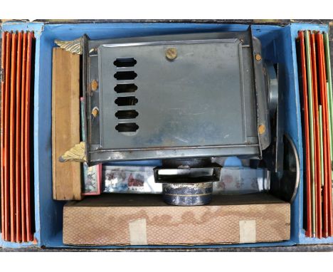 A German boxed toy tinplate magic lantern and slides by G.C. & Co