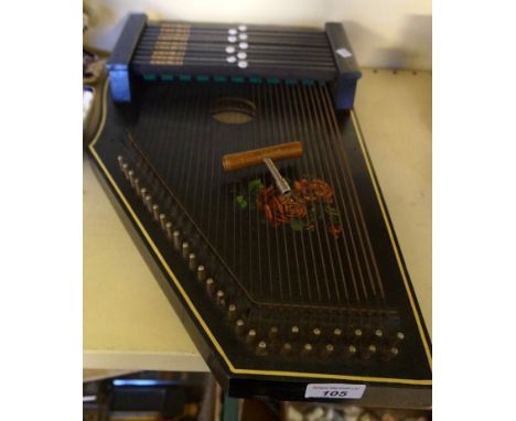 A Vintage zither with tuning key.